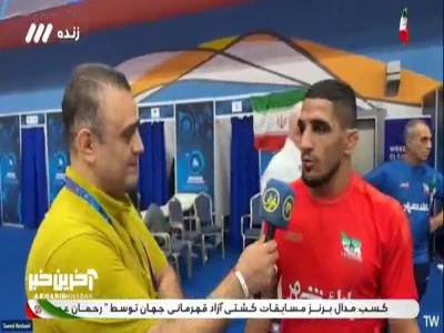 رحمان عموزاد پس از کسب مدال برنز ......